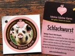 Wurst mit Bildern von verarbeiteten Schweinen